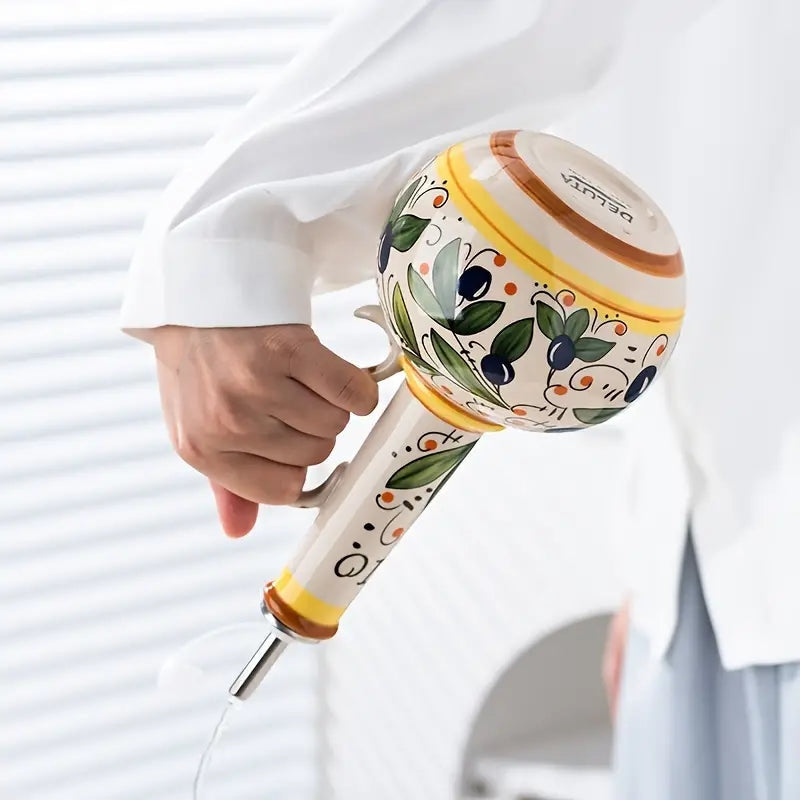 AromaPour – Oil Dispenser With Floral Pattern And Hand Grip Design